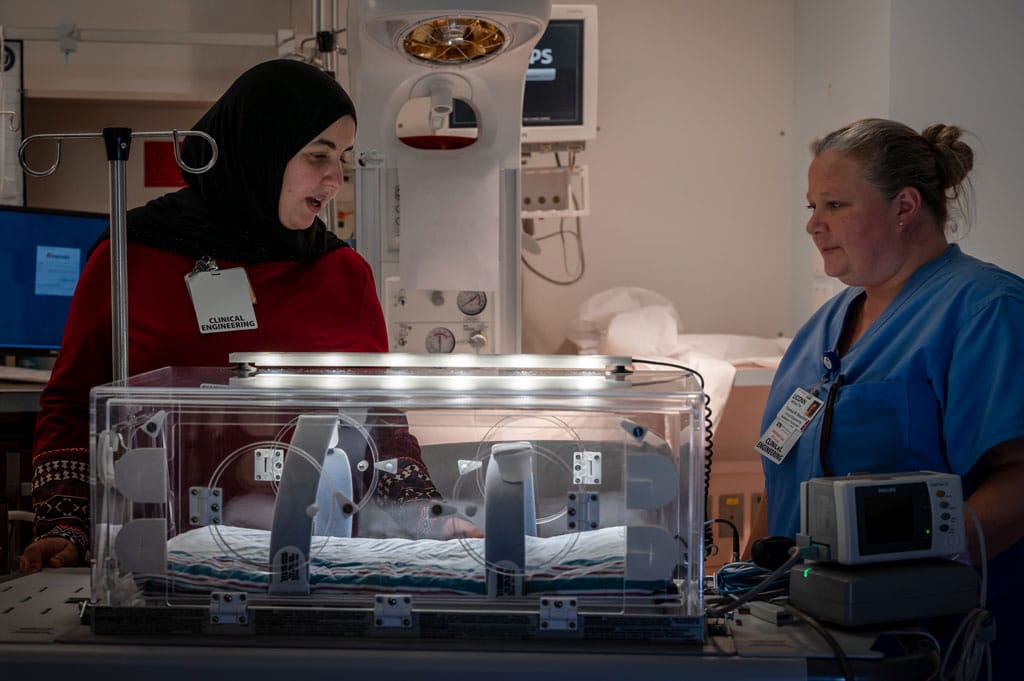 Ounssa (BMET I) and Theresa (BMETI) are completing a PM on an incubator in the NICU department.
