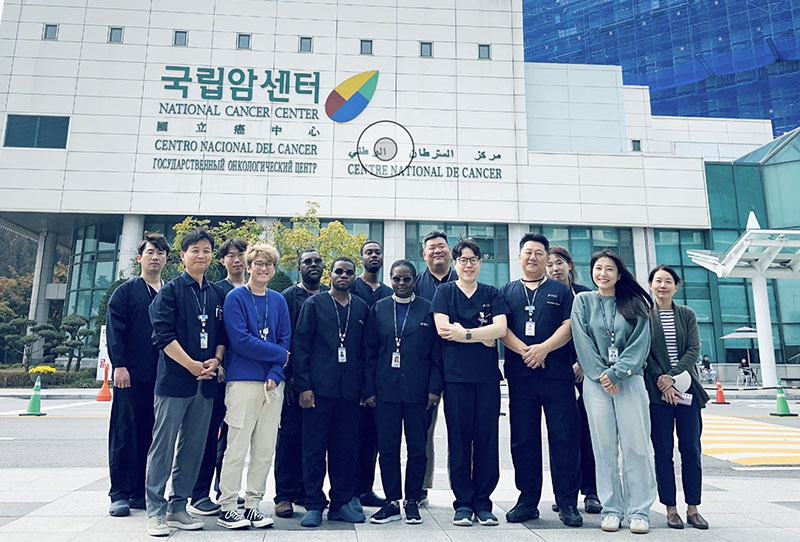 Left, Ivory Coast education and training project team from June to November 2023. Right, a department-created cradle for patient monitors to accommodate barcodes, thermometers, etc.